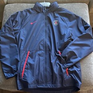 Paris Saint - Germain Nike Men's Dark Blue Windbreaker with Red Accents